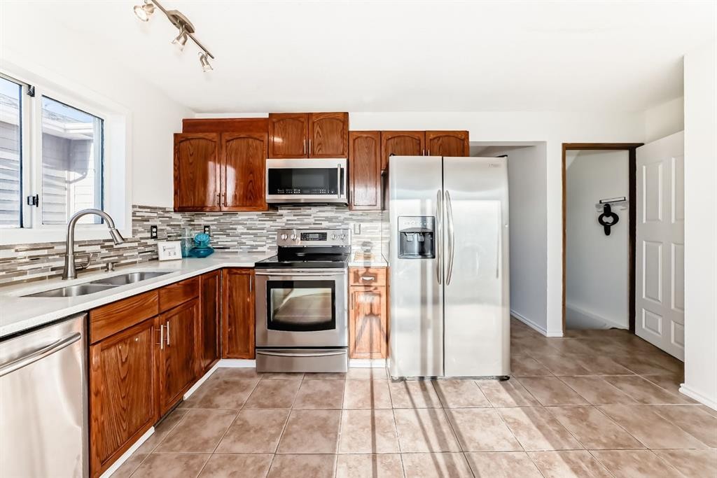 11 Martinridge Place Ne, Calgary, AB - Indoor Photo Showing Kitchen With Stainless Steel Kitchen With Double Sink