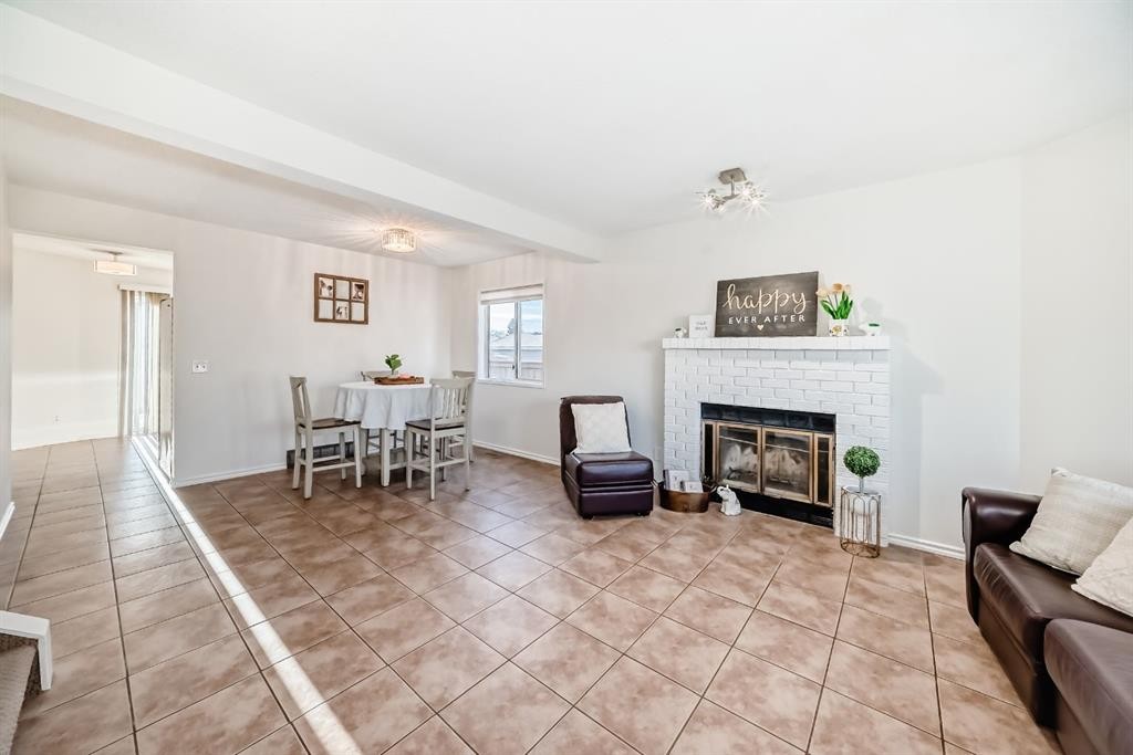 11 Martinridge Place Ne, Calgary, AB - Indoor Photo Showing Living Room With Fireplace