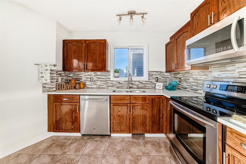 11 Martinridge Place Ne, Calgary, AB - Indoor Photo Showing Kitchen With Stainless Steel Kitchen With Double Sink