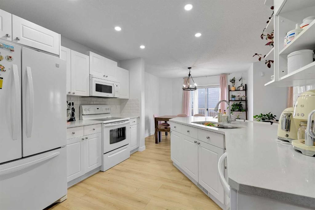60 Saddlecrest Green Ne, Calgary, AB - Indoor Photo Showing Kitchen With Double Sink