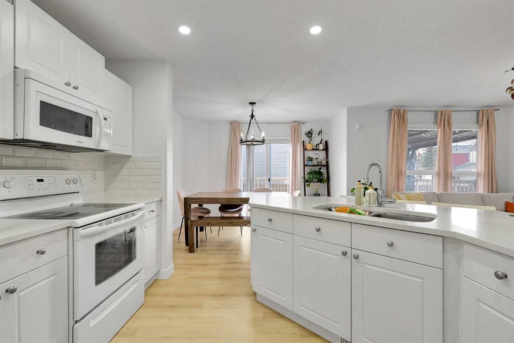 60 Saddlecrest Green Ne, Calgary, AB - Indoor Photo Showing Kitchen With Double Sink