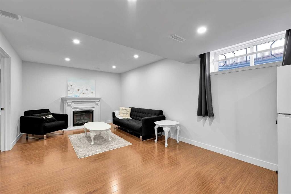 60 Saddlecrest Green Ne, Calgary, AB - Indoor With Fireplace