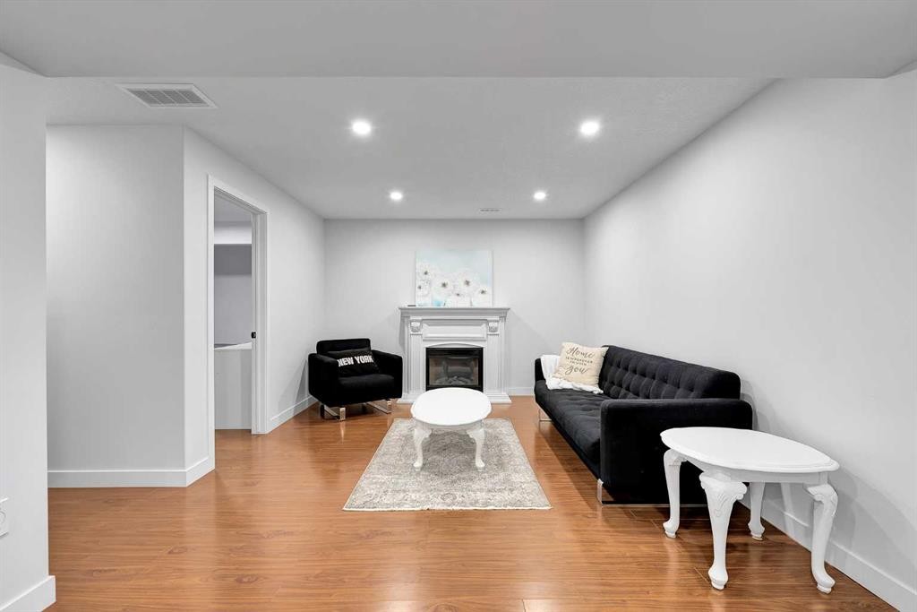 60 Saddlecrest Green Ne, Calgary, AB - Indoor Photo Showing Living Room With Fireplace