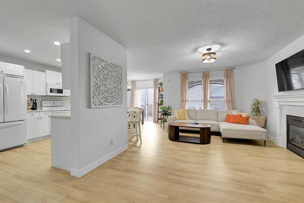 60 Saddlecrest Green Ne, Calgary, AB - Indoor With Fireplace