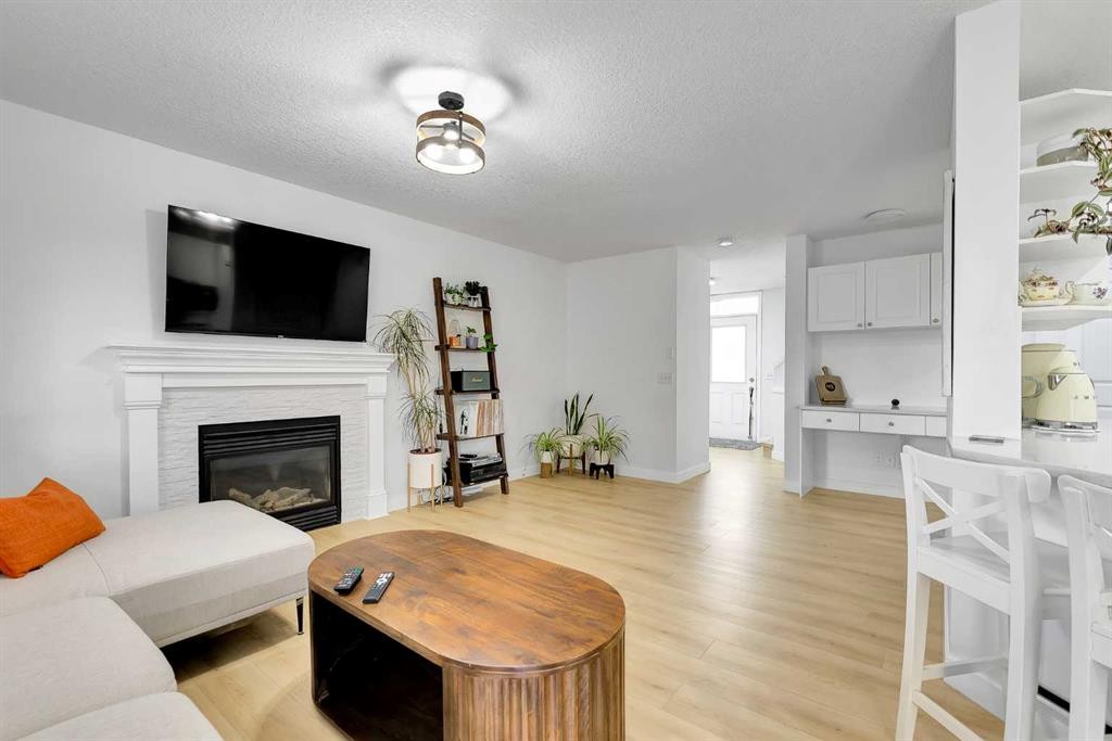 60 Saddlecrest Green Ne, Calgary, AB - Indoor Photo Showing Living Room With Fireplace