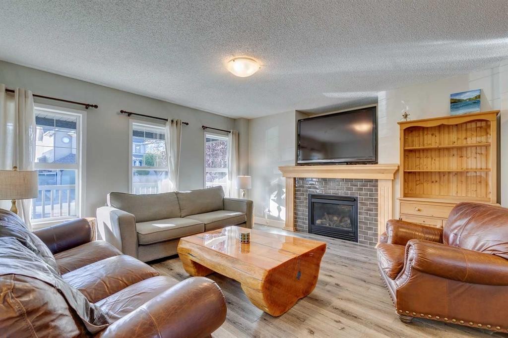199 Everglen Way Sw, Calgary, AB - Indoor Photo Showing Living Room With Fireplace