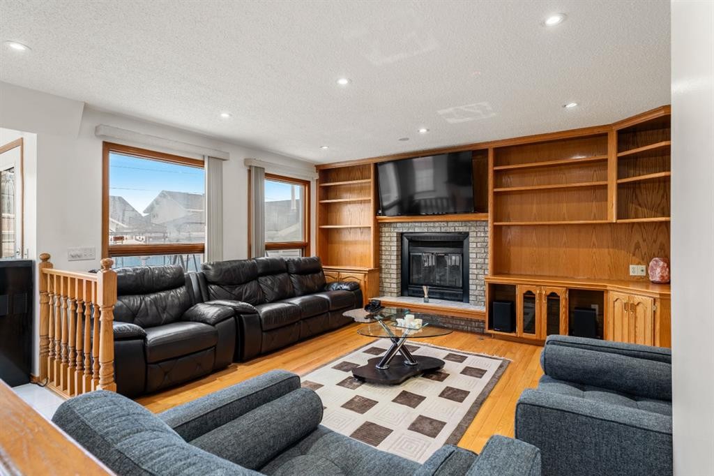 107 Pasadena Green Ne, Calgary, AB - Indoor Photo Showing Living Room With Fireplace