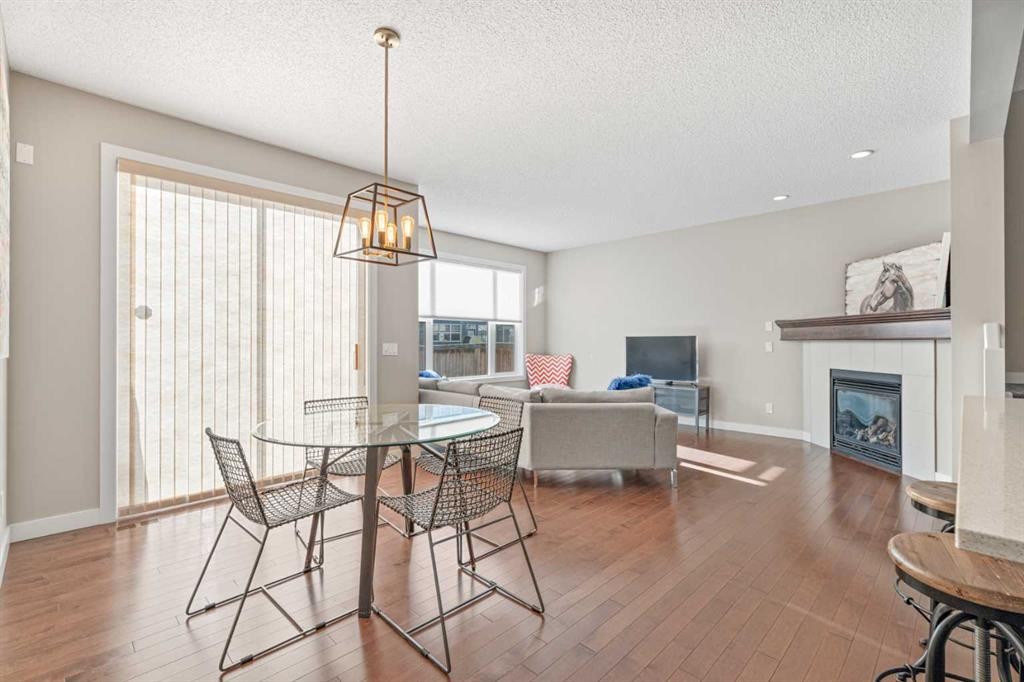 308 Chaparral Valley Way Se, Calgary, AB - Indoor Photo Showing Dining Room With Fireplace