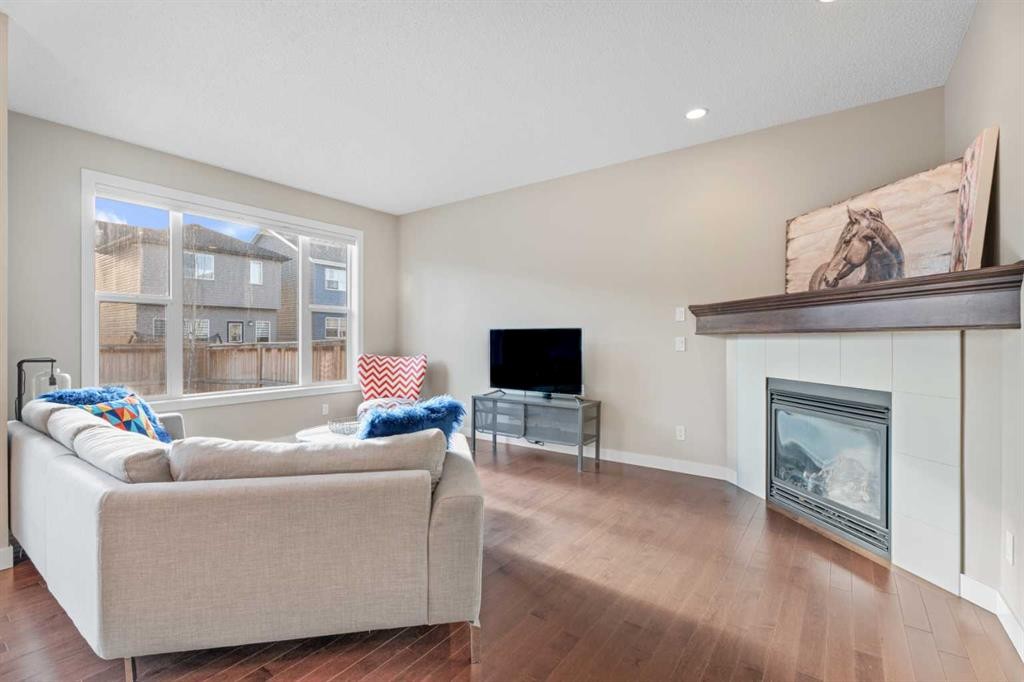 308 Chaparral Valley Way Se, Calgary, AB - Indoor Photo Showing Living Room With Fireplace