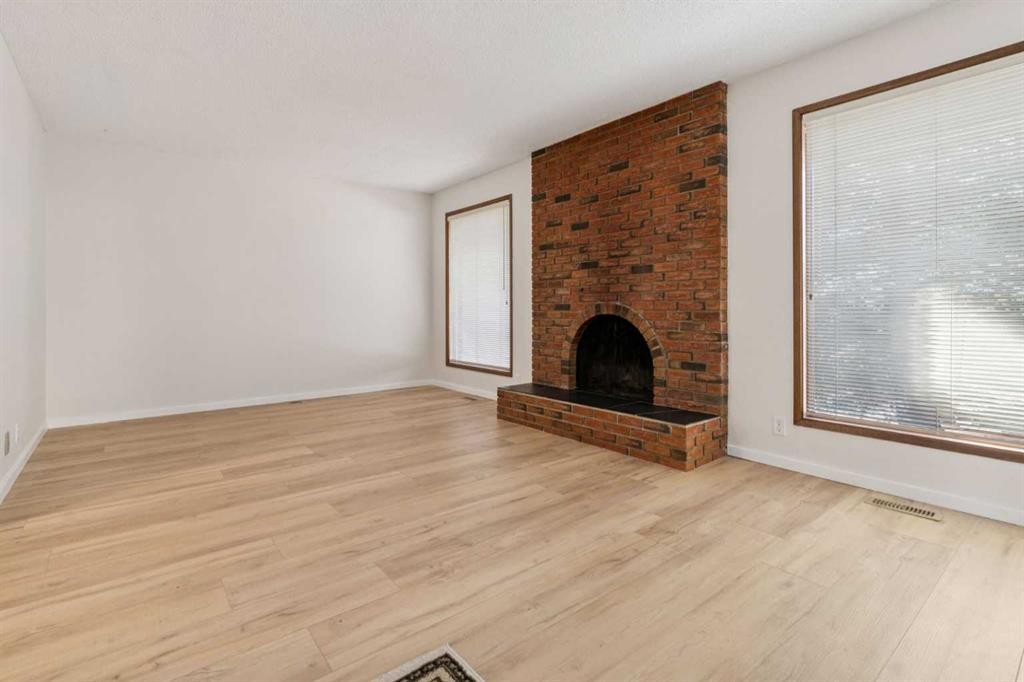 91 Edgehill Drive Nw, Calgary, AB - Indoor Photo Showing Living Room With Fireplace