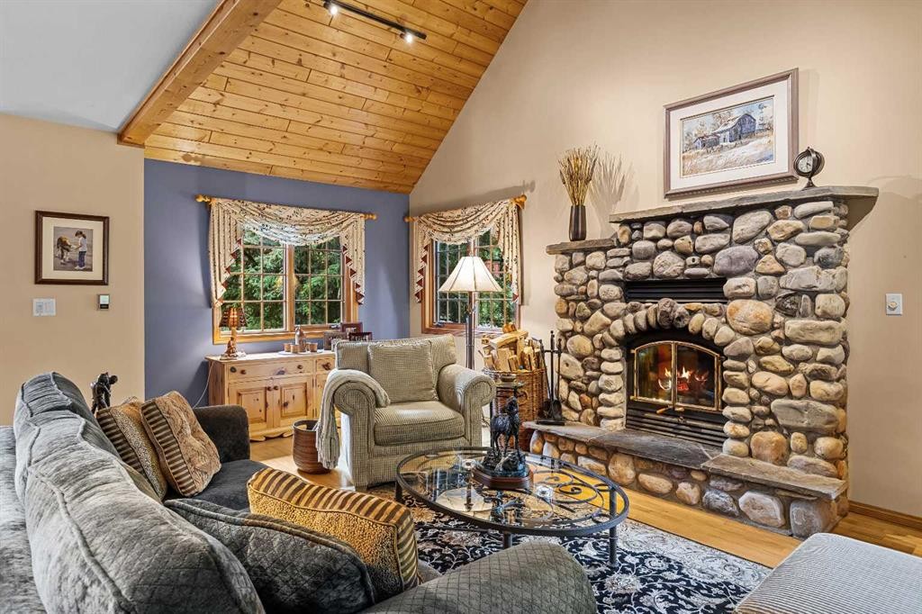 216 Bow River Drive, Harvie Heights, AB - Indoor Photo Showing Living Room With Fireplace
