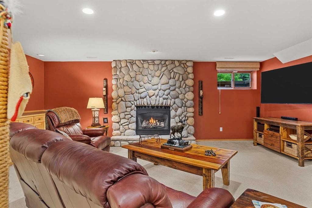 216 Bow River Drive, Harvie Heights, AB - Indoor Photo Showing Living Room With Fireplace