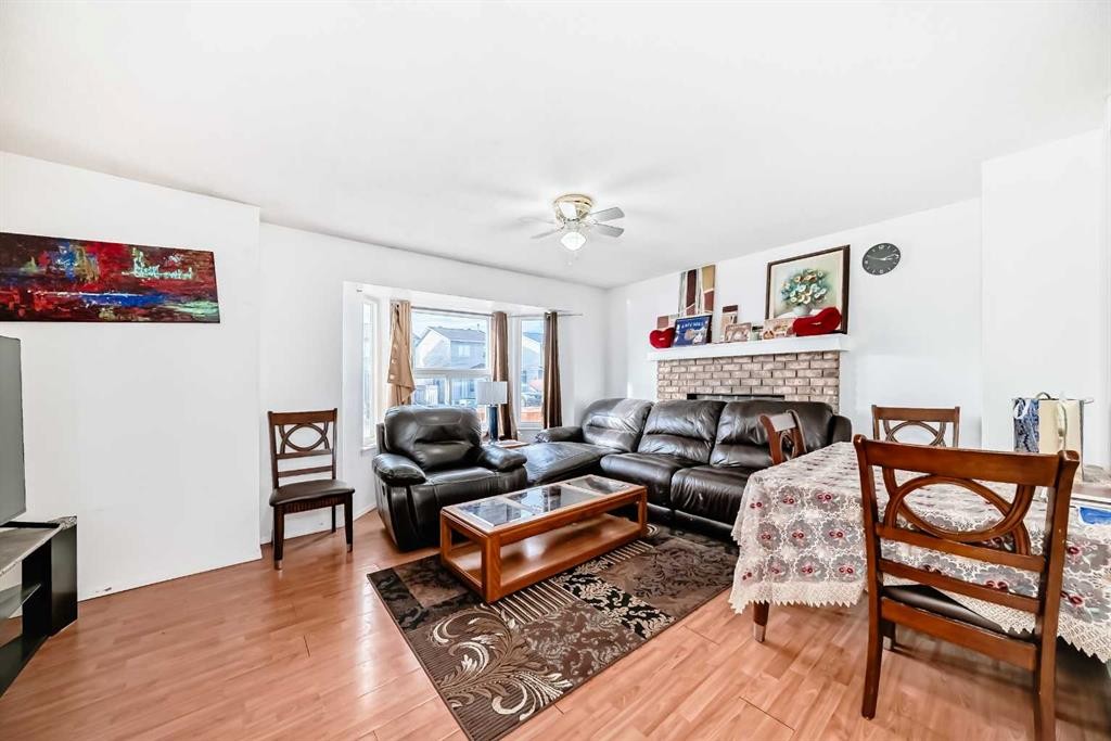 104 Falmere Way Ne, Calgary, AB - Indoor Photo Showing Living Room With Fireplace