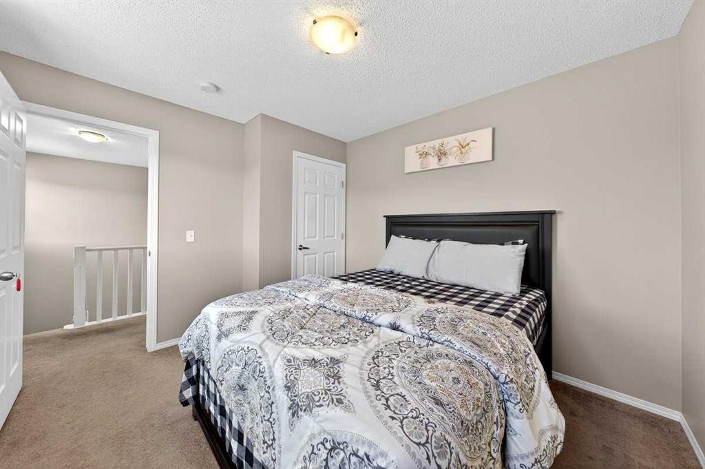 899 Windhaven Close Sw, Airdrie, AB - Indoor Photo Showing Bedroom