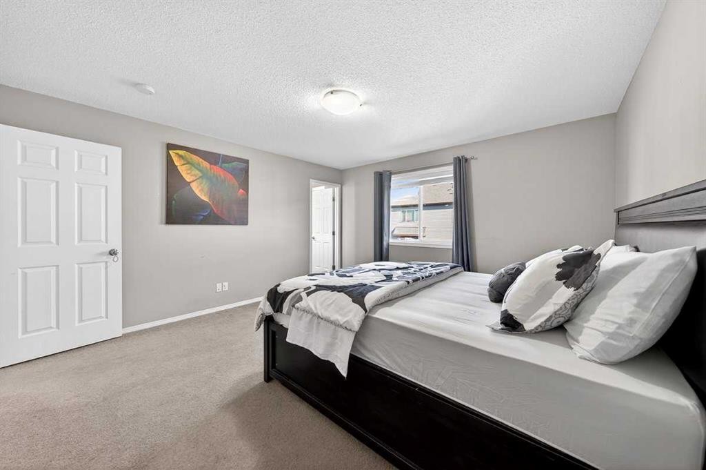 899 Windhaven Close Sw, Airdrie, AB - Indoor Photo Showing Bedroom