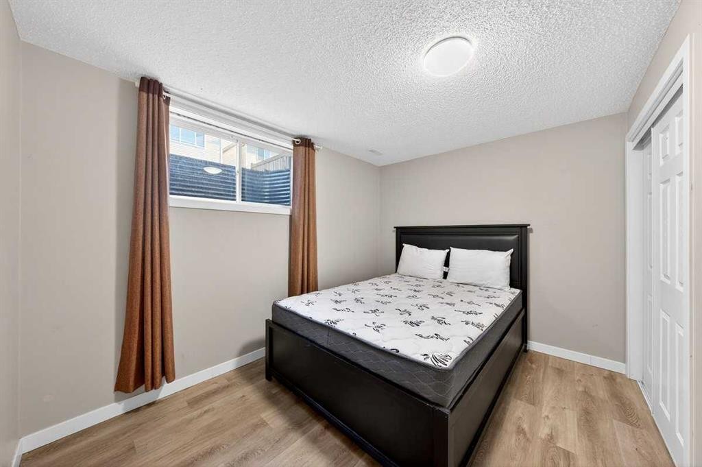899 Windhaven Close Sw, Airdrie, AB - Indoor Photo Showing Bedroom