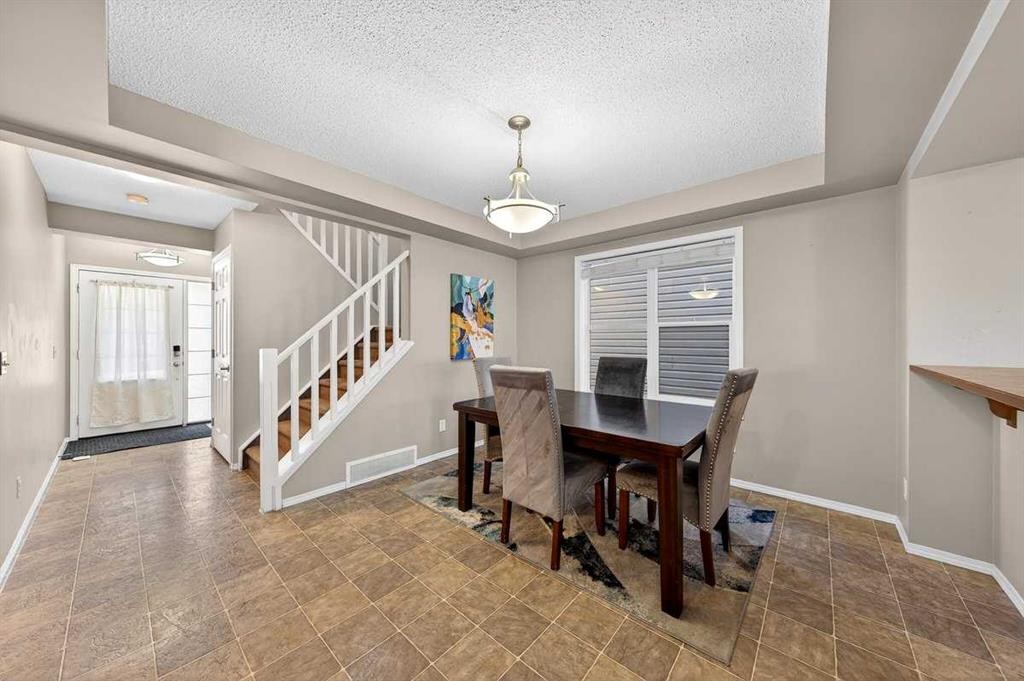 899 Windhaven Close Sw, Airdrie, AB - Indoor Photo Showing Dining Room