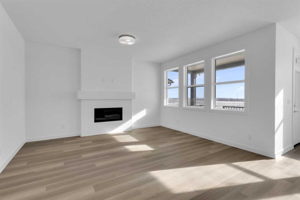 144 Copperhead Road Se, Calgary, AB - Indoor Photo Showing Living Room With Fireplace