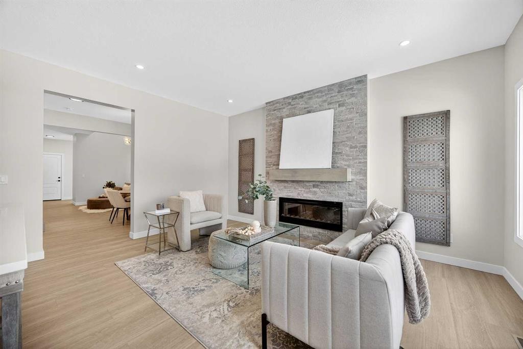 52 Fireside Common Sw, Cochrane, AB - Indoor Photo Showing Living Room With Fireplace