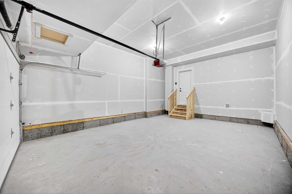 52 Fireside Common Sw, Cochrane, AB - Indoor Photo Showing Garage