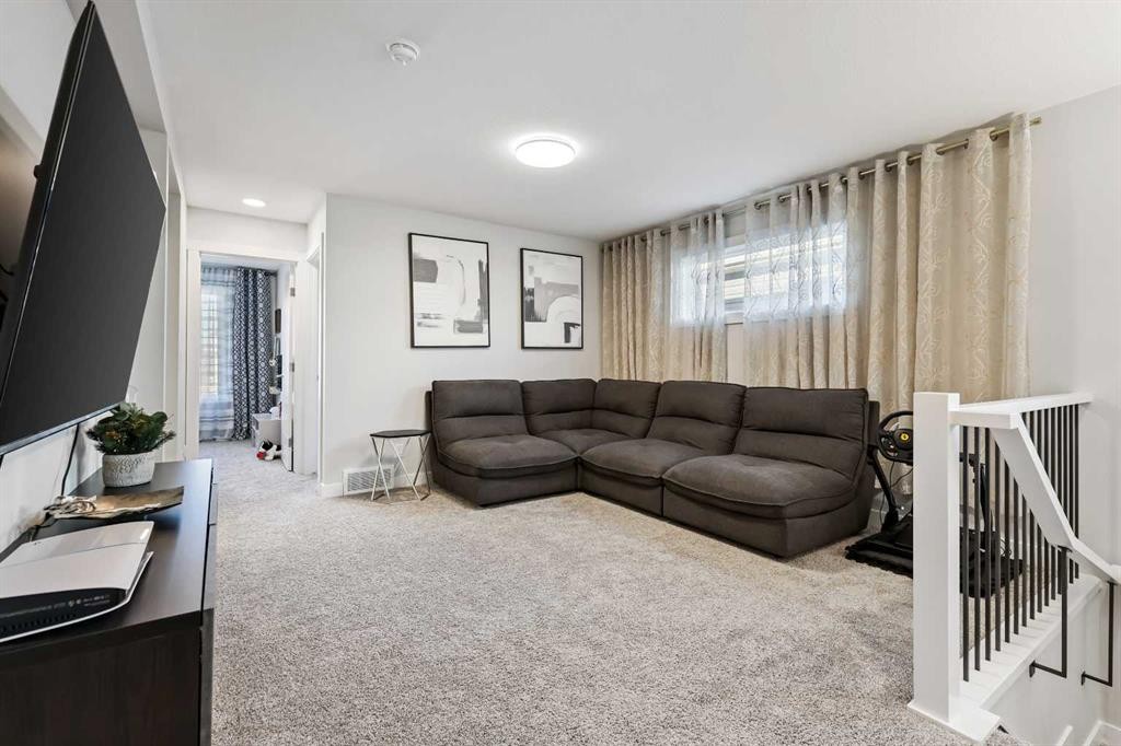 128 Setonstone Gardens Se, Calgary, AB - Indoor Photo Showing Living Room