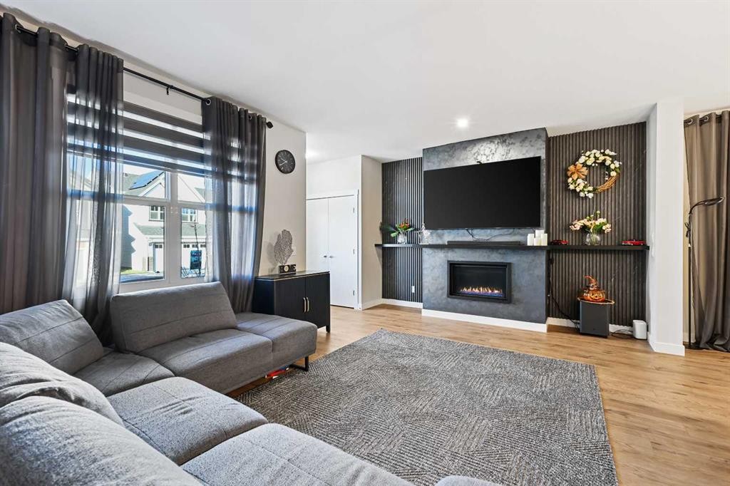 128 Setonstone Gardens Se, Calgary, AB - Indoor Photo Showing Living Room With Fireplace