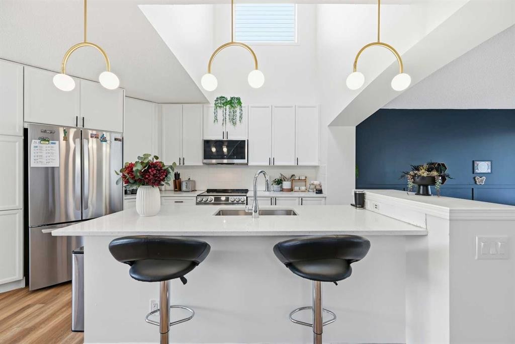 41 New Brighton Green Se, Calgary, AB - Indoor Photo Showing Kitchen With Double Sink With Upgraded Kitchen