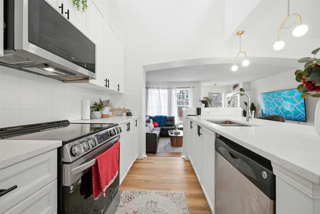 41 New Brighton Green Se, Calgary, AB - Indoor Photo Showing Kitchen With Double Sink
