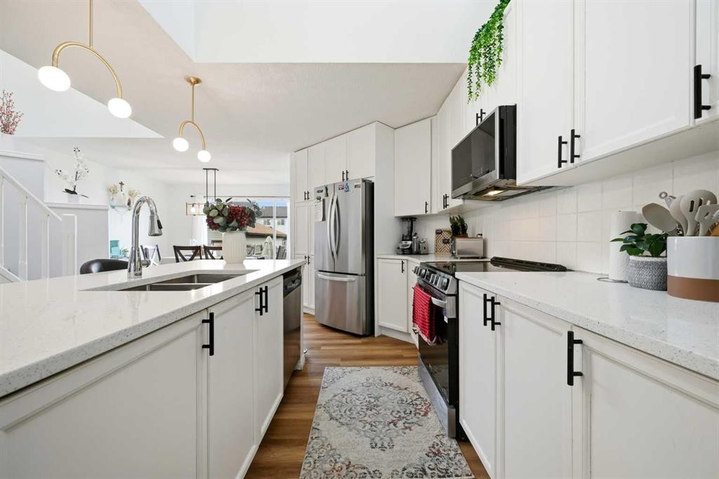 41 New Brighton Green Se, Calgary, AB - Indoor Photo Showing Kitchen With Double Sink With Upgraded Kitchen