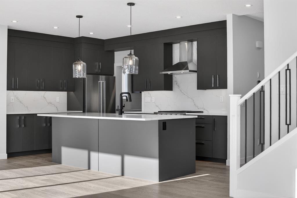 709 Dawson Place, Chestermere, AB - Indoor Photo Showing Kitchen With Upgraded Kitchen