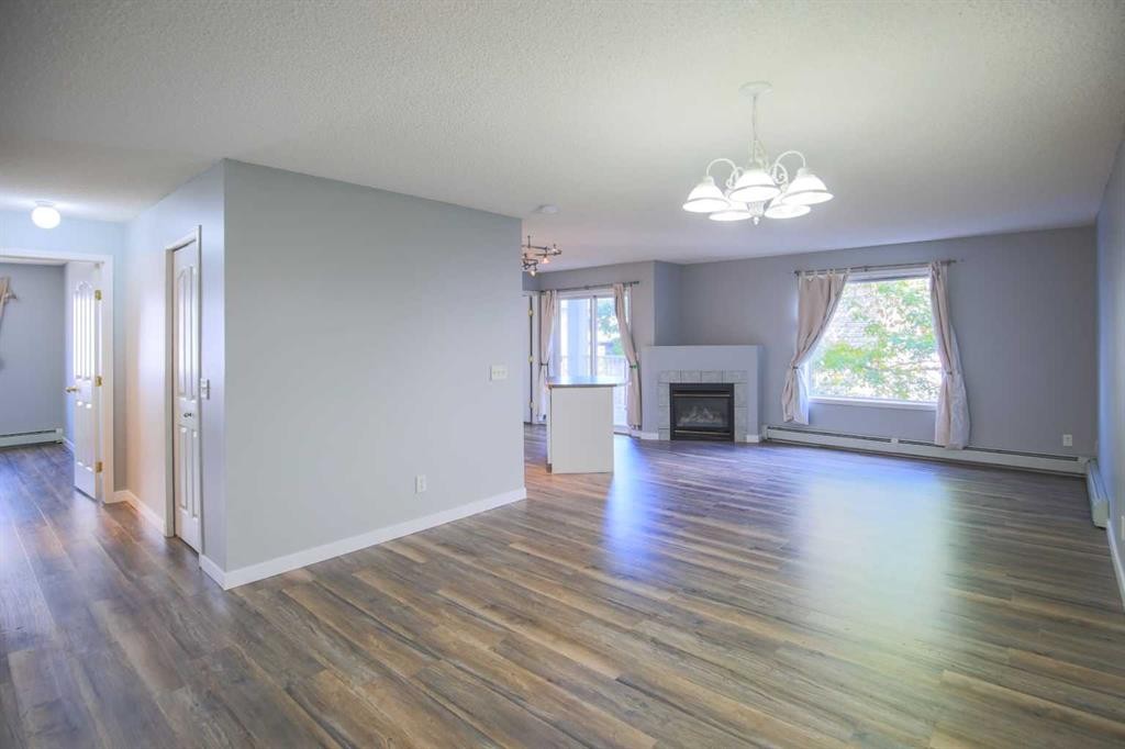 202-5202 Valleyview Park Se, Calgary, AB - Indoor Photo Showing Living Room With Fireplace