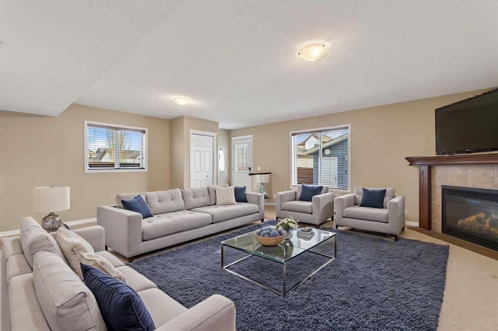 250 Silverado Plains Close Sw, Calgary, AB - Indoor Photo Showing Living Room With Fireplace
