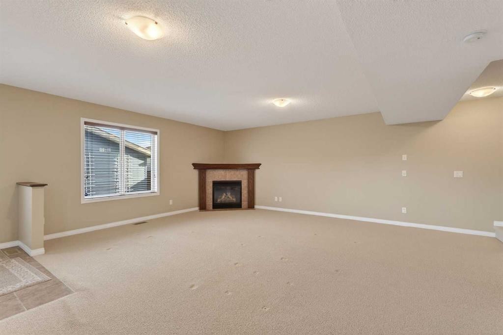 250 Silverado Plains Close Sw, Calgary, AB - Indoor With Fireplace
