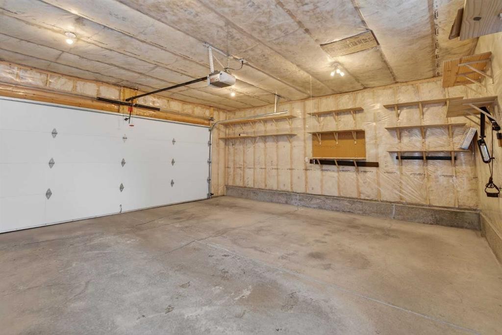 250 Silverado Plains Close Sw, Calgary, AB - Indoor Photo Showing Garage