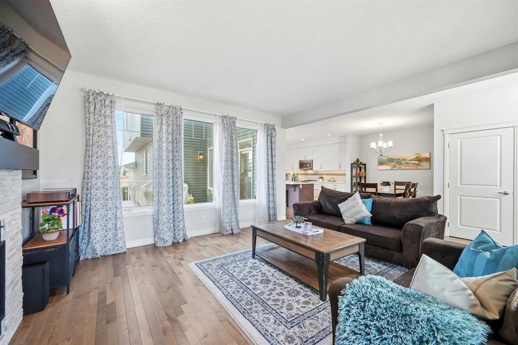 8 Redstone Passage Ne, Calgary, AB - Indoor Photo Showing Living Room With Fireplace