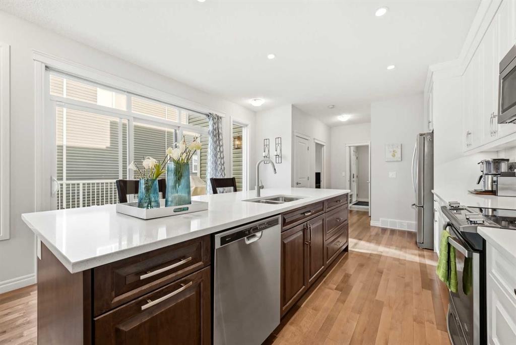 8 Redstone Passage Ne, Calgary, AB - Indoor Photo Showing Kitchen With Stainless Steel Kitchen With Double Sink With Upgraded Kitchen