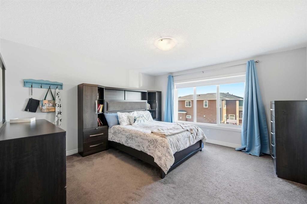 8 Redstone Passage Ne, Calgary, AB - Indoor Photo Showing Bedroom