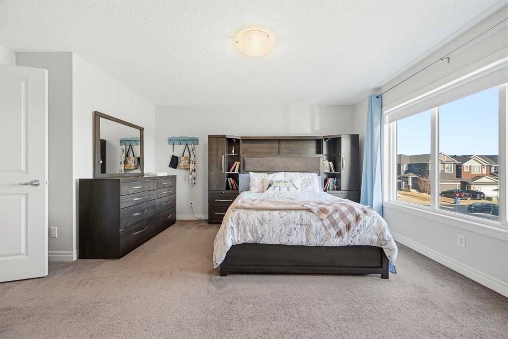8 Redstone Passage Ne, Calgary, AB - Indoor Photo Showing Bedroom