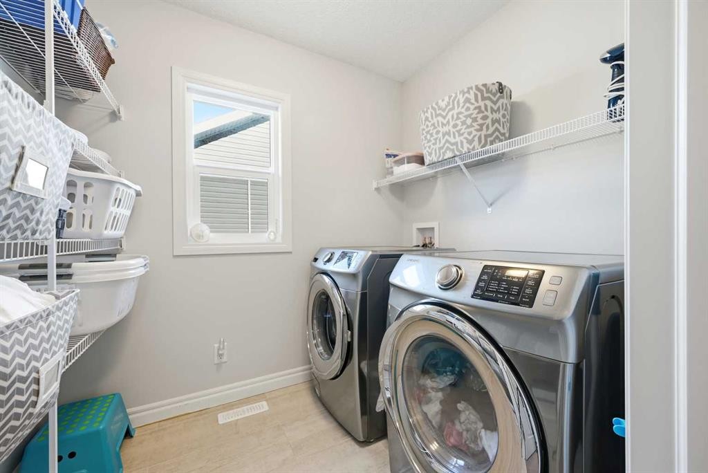 8 Redstone Passage Ne, Calgary, AB - Indoor Photo Showing Laundry Room