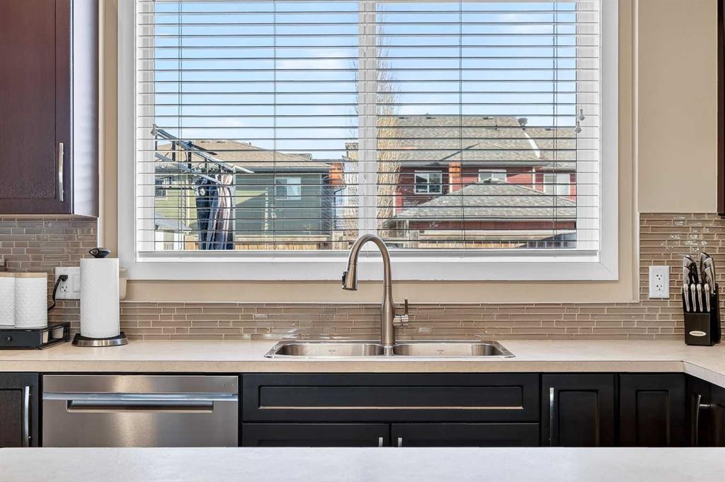 90 Walden Crescent Se, Calgary, AB - Indoor Photo Showing Kitchen With Double Sink