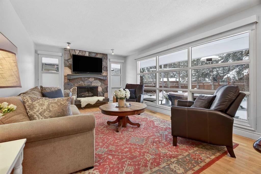 6913 Leaside Drive Sw, Calgary, AB - Indoor Photo Showing Living Room With Fireplace