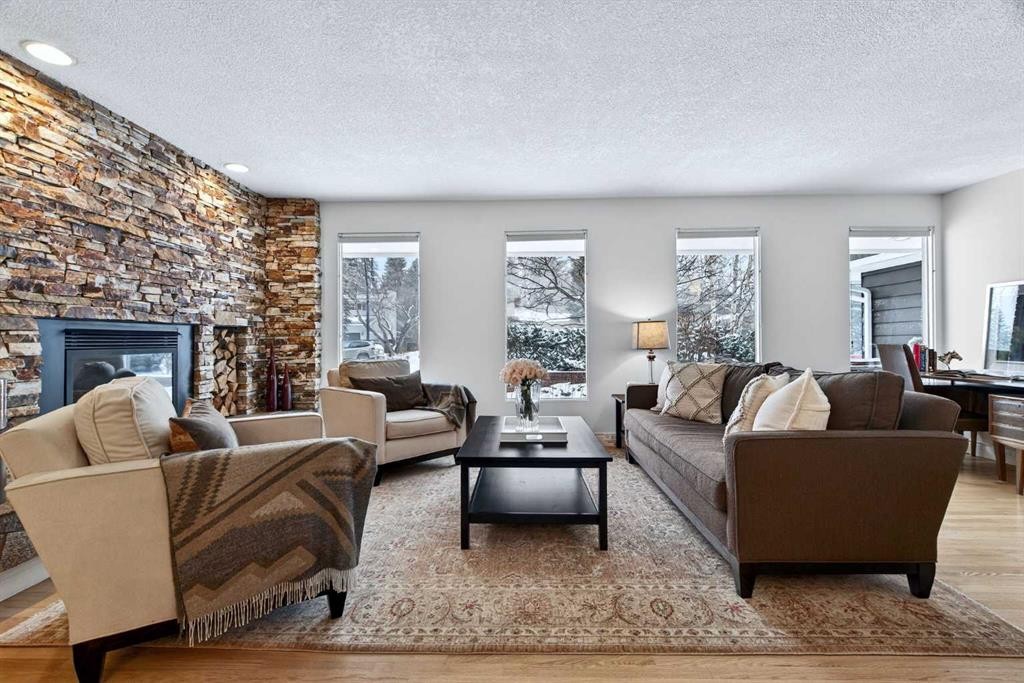6913 Leaside Drive Sw, Calgary, AB - Indoor Photo Showing Living Room With Fireplace