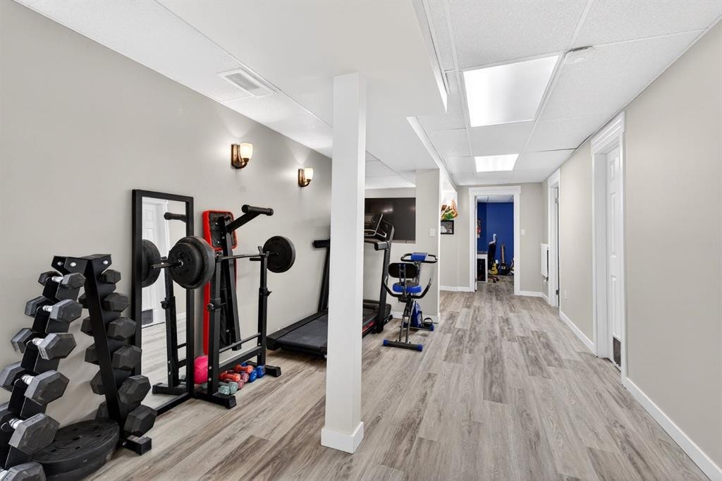 108 Cimarron Grove Circle, Okotoks, AB - Indoor Photo Showing Gym Room