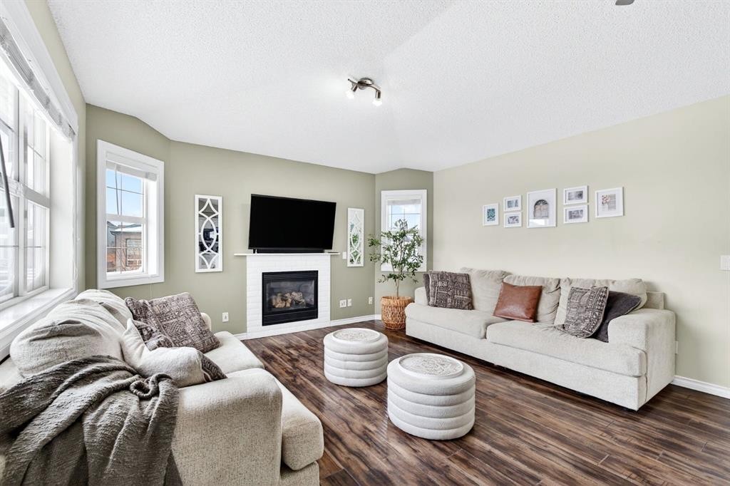 108 Cimarron Grove Circle, Okotoks, AB - Indoor Photo Showing Living Room With Fireplace