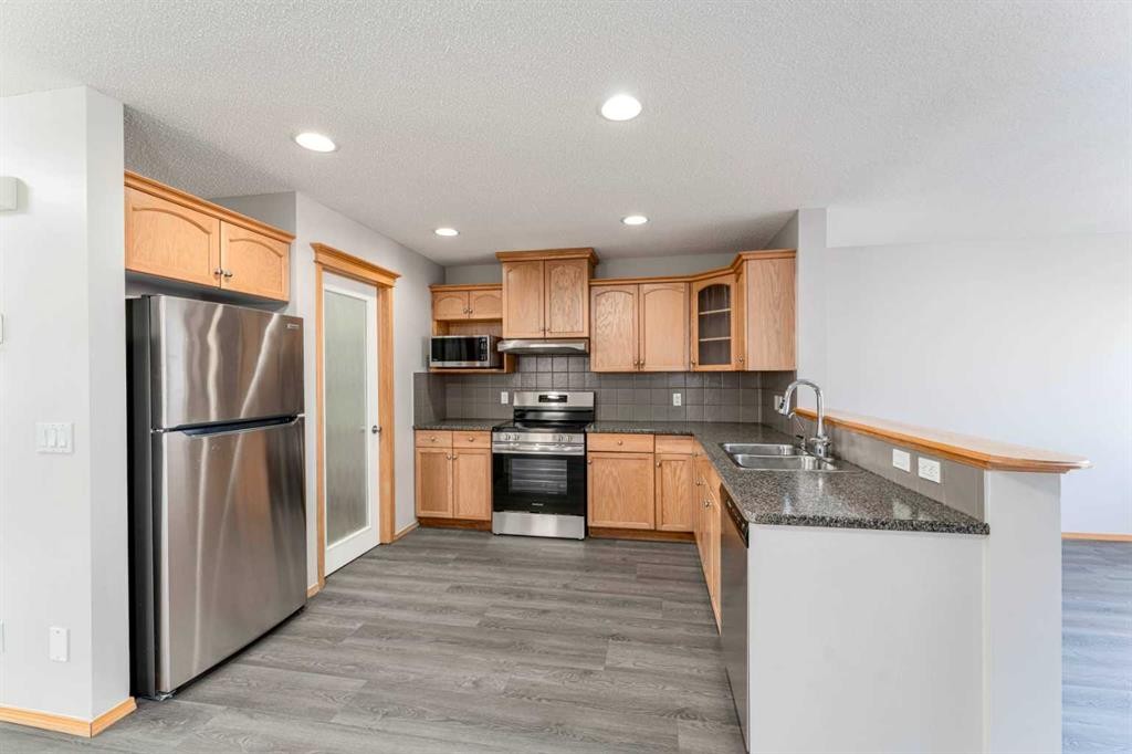 14 Taralea Bay Ne, Calgary, AB - Indoor Photo Showing Kitchen With Double Sink