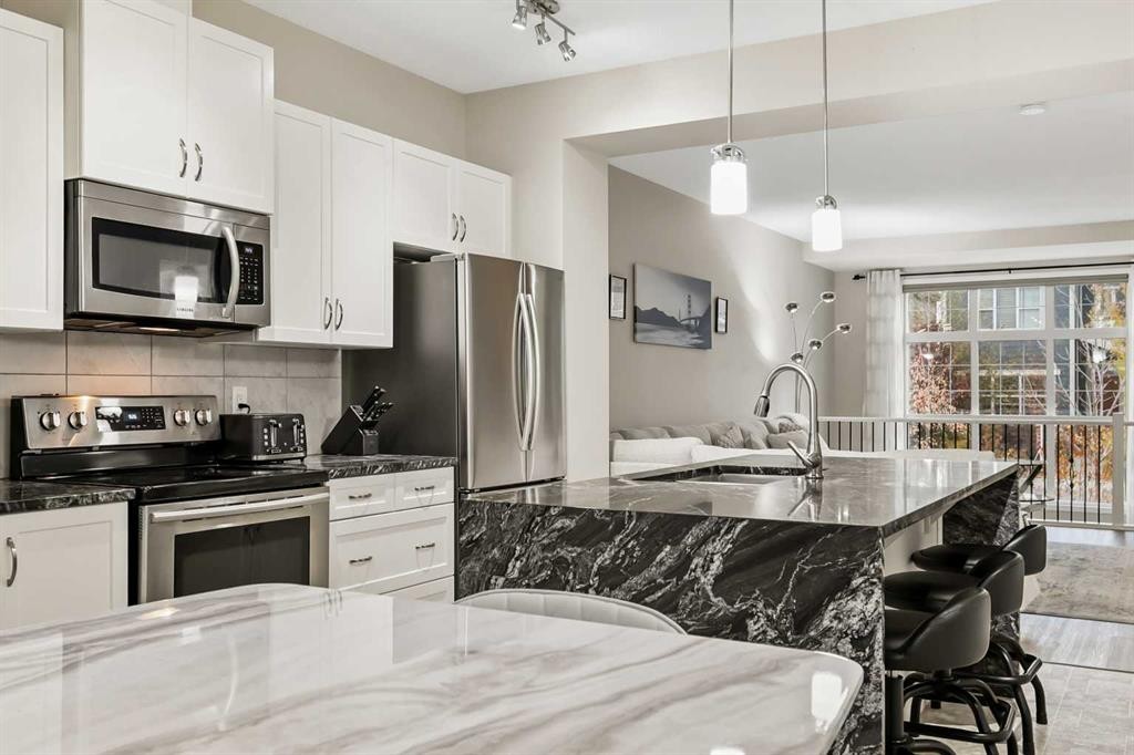 143 Masters Link Se, Calgary, AB - Indoor Photo Showing Kitchen With Stainless Steel Kitchen With Upgraded Kitchen