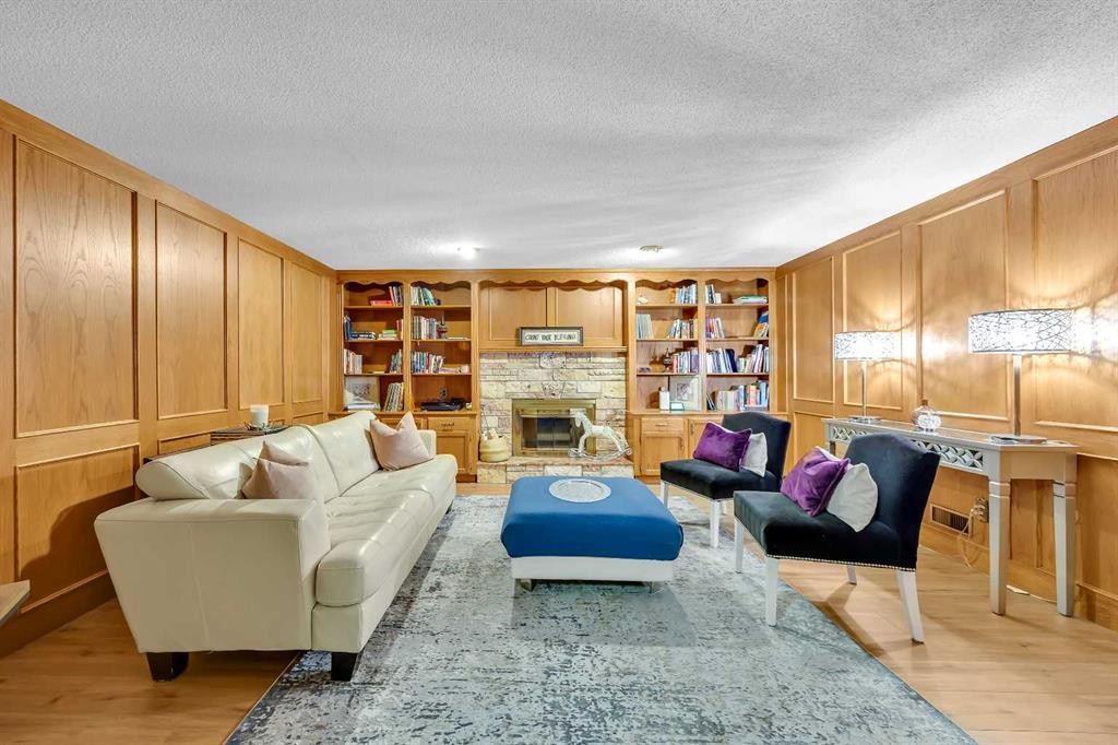 874 Riverbend Drive Se, Calgary, AB - Indoor Photo Showing Living Room With Fireplace