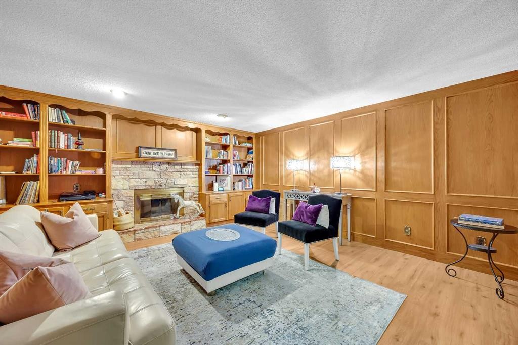 874 Riverbend Drive Se, Calgary, AB - Indoor Photo Showing Living Room With Fireplace