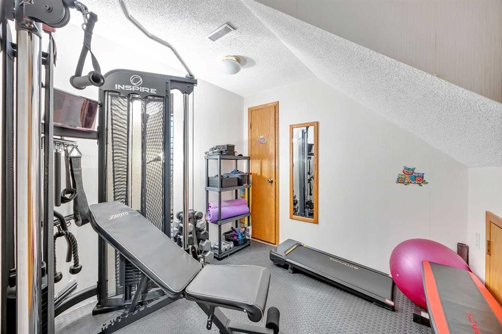 874 Riverbend Drive Se, Calgary, AB - Indoor Photo Showing Gym Room