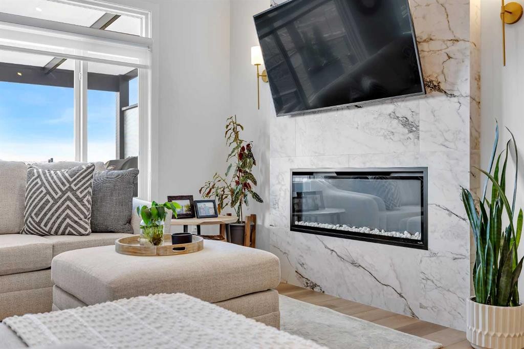 13 Emerson Crescent, Okotoks, AB - Indoor Photo Showing Living Room With Fireplace